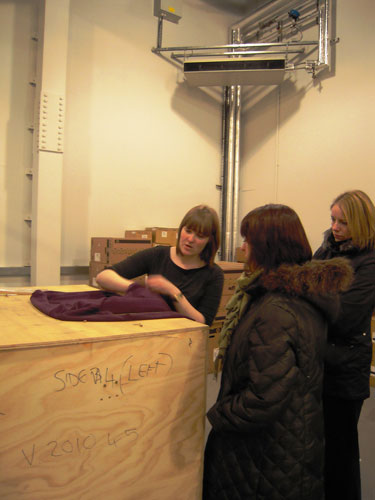 Sarah demonstrates techniques for packing textiles