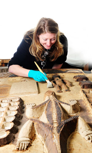 Conservation staff working at the National Museums Collection Centre