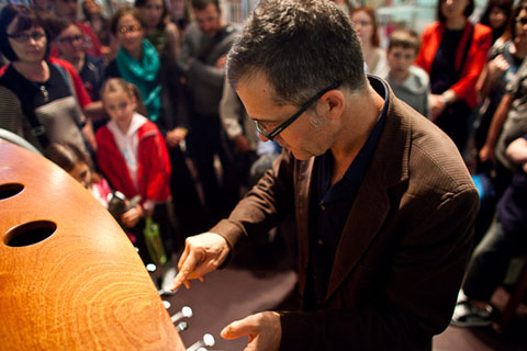 Victor Gama demonstrates one of his instruments at the opening of the National Museum of Scotland