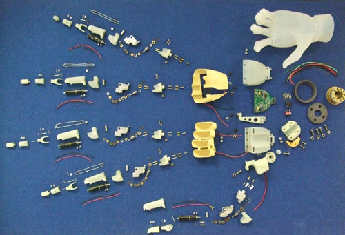 The about 300 parts which went into the first model i-limb, pinned to a noticeboard at Touch Bionics’ workshop.