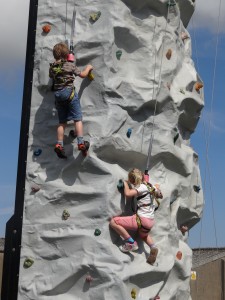 Visitors having a go at the climbing wall at the Airshow at the National Museum of Flight, East Fortune on Saturday 27 July 2013