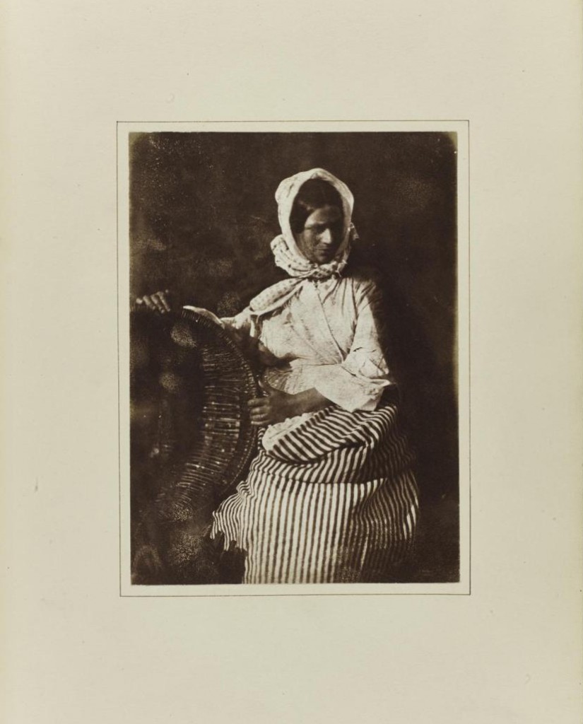 Salt print depicting Mrs Elizabeth (Johnstone) Hall, a Newhaven fishwife holding an empty creel.