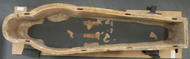Bottom of barrier layer to protect mummy and textile remains on floor of coffin