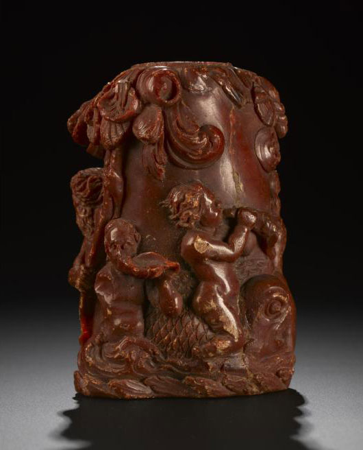 Snuff bottle of opaque brown amber carved in relief with a triumph of Aphrodite: Prussian, 18th century