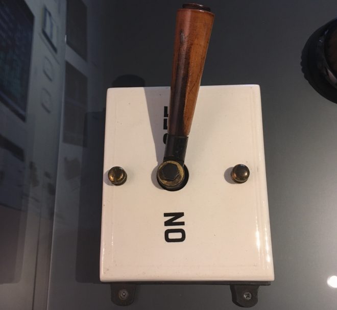 Electric main switch, porcelain covered with large wooden handle, found during alterations to the Scotsman offices, originally wired by The Scottish Electrical Engineering Co. of Edinburgh, early 20th century