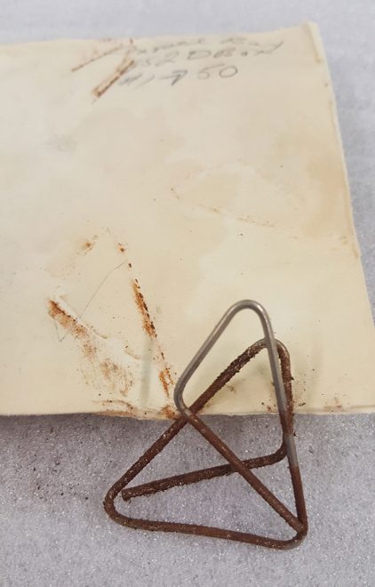 Acetate peels with old envelopes and corroded clips.