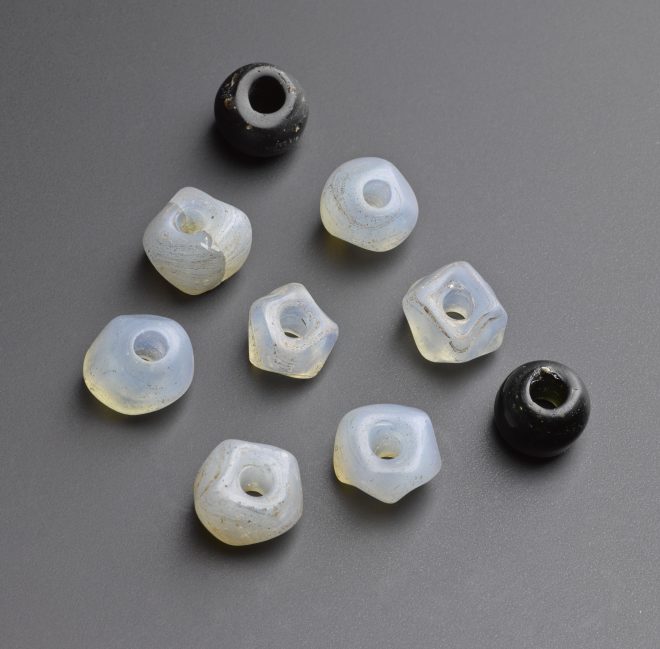 Beads made from opalescent and black glass form Morham, East Lothian