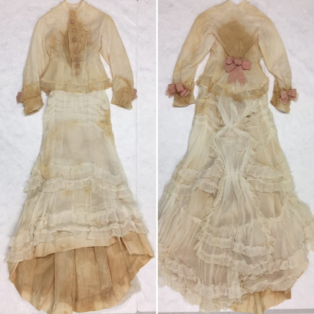 Day dress in white cotton muslin with pink corded silk satin bows c.1876