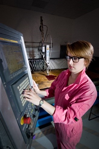 Erin Dickson at work with the waterjet cutter at the National Glass Centre, Sunderland. Photo: Colin Davison