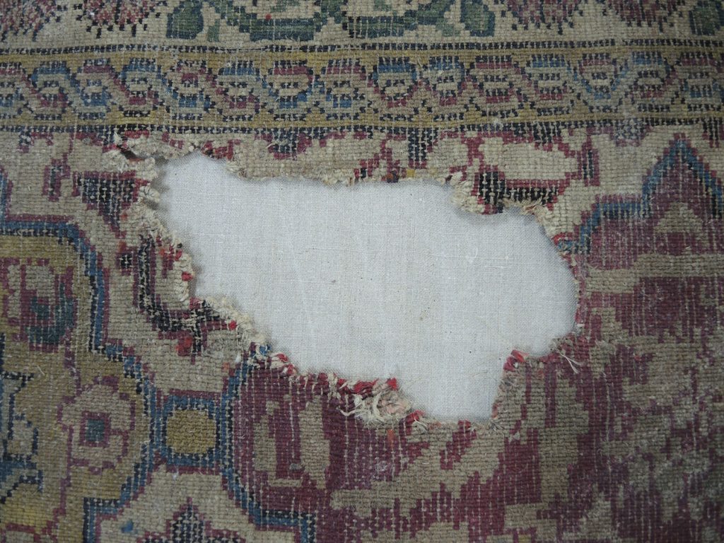 Painted patch removed from reverse of the carpet