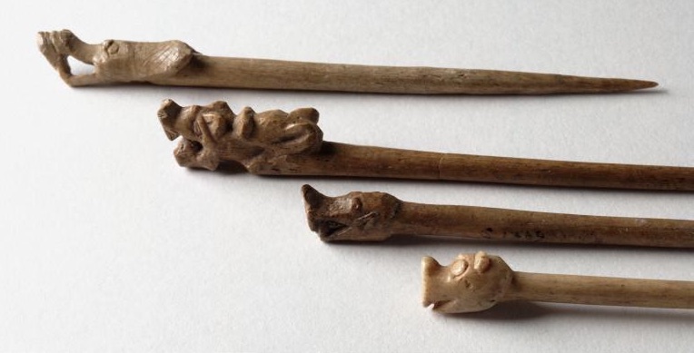 Animal-headed bone dress pins from Jarlshof, Shetland, AD 800 - 1100.