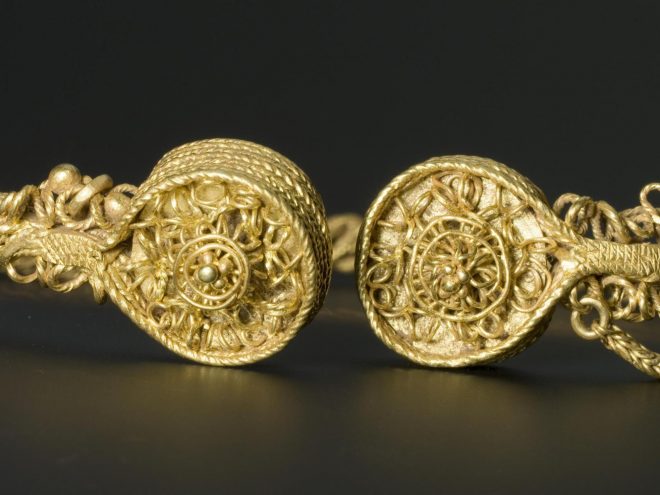 Loop-terminal torc of gold, with braided hoop, the terminals, linked by a chain, decorated with wire-work and granulation, Iron Age, found as part of a hoard comprising four torcs, at Blair Drummond, Perthshire, on 28 September 2009