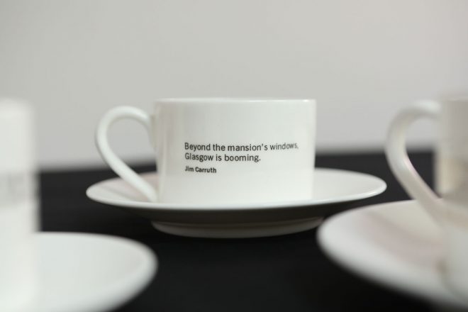 A tea cup from the tea set, inscribed with a poem by Jim Carruth.