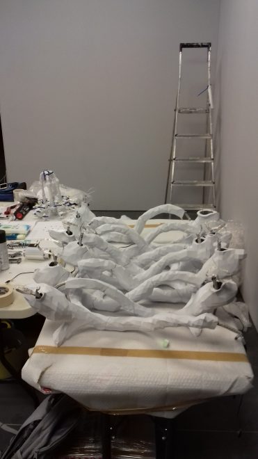 Some of the pixeled dolphin arms waiting to be fitted to the chandelier Photo: Sarah Rothwell