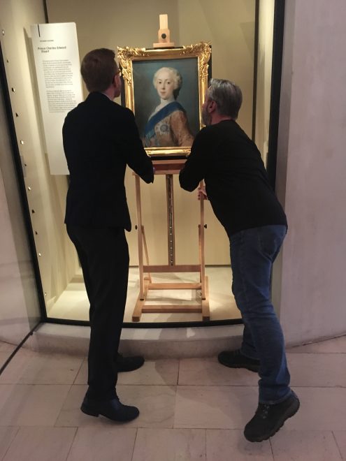 National Museums Scotland staff installing the portrait in the Scotland galleries.