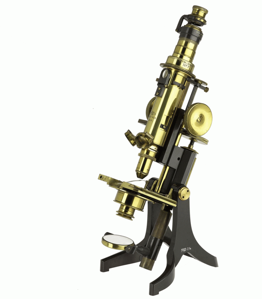 A brass petrological microscope, with lots of attachments and details