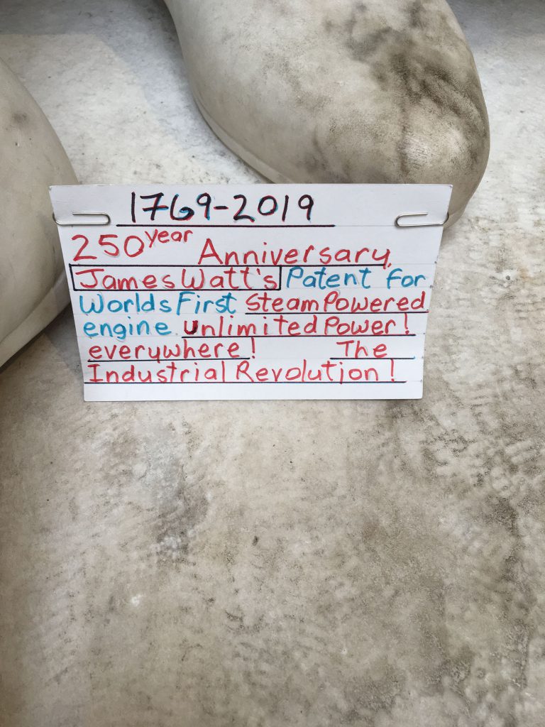 Note left on James Watt's statue earlier in 2019. It reads: "1769 – 2019. 250th Anniversary James Watt's Patent for World's First Steam Powered engine. Unlimited power! Everywhere! The Industrial Revolution!"