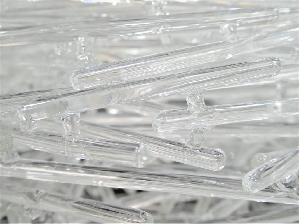 Detail of glass sculpture – stacked glass rods adhered together with lampworked glass segments.