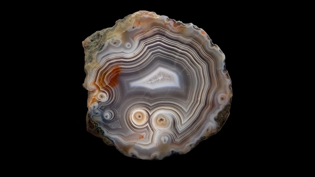 A brown and white agate in a swirly pattern.