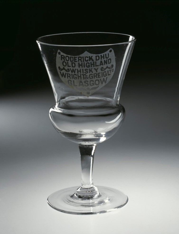 Clear wine glass with a narrow stem, thick rounded basin and circular glass.