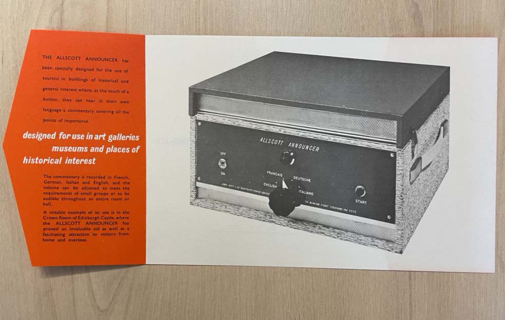 Colour photo of a black and white printer leaflet with an illustration on an audio device and a red flap panel with black and white text.