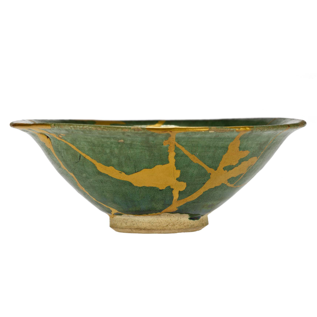 A green bowl with cold cracks.