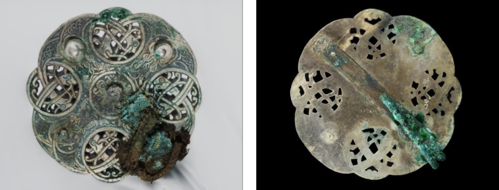 Front and back of brooch before conservation displayed side-by-side. Tinted green and weathered with patches of degradation.