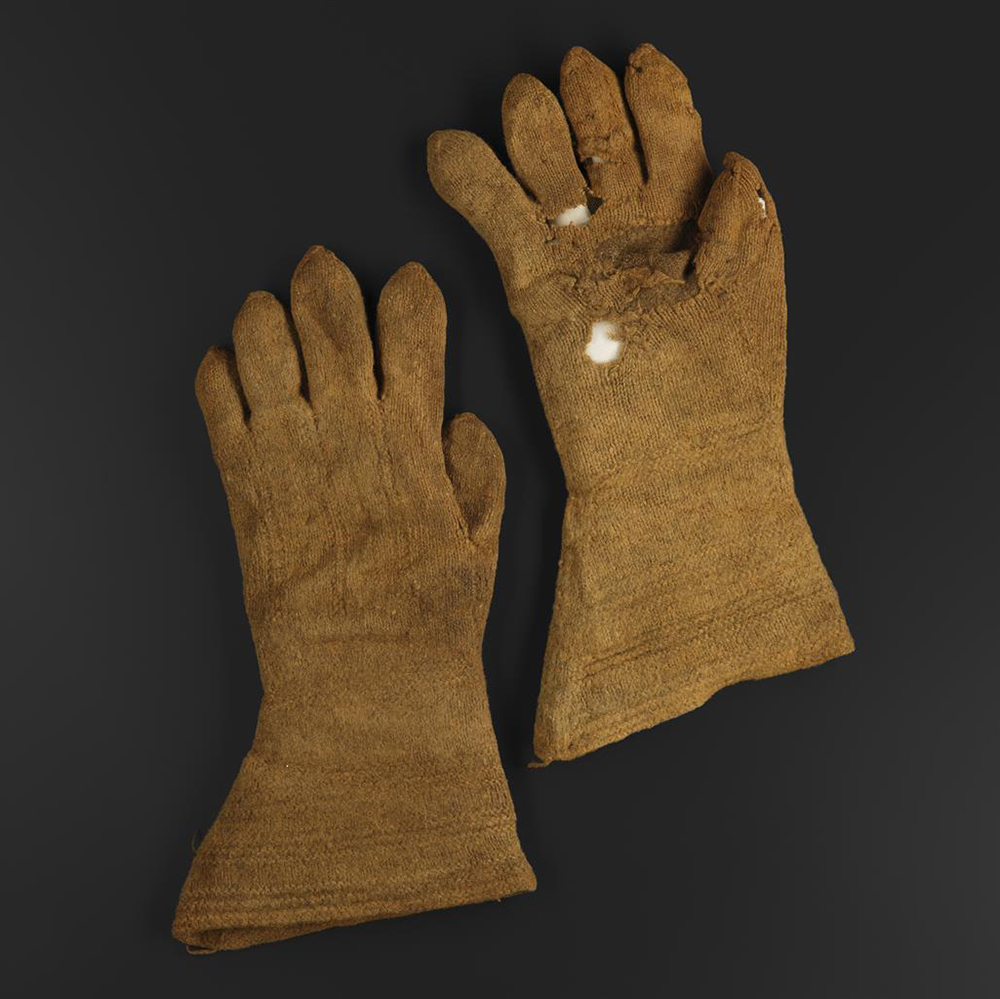 A pair of yellowish gloves.