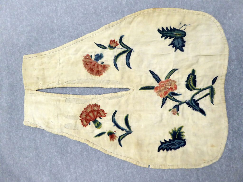 A white pocket embroidered with flower motifs.