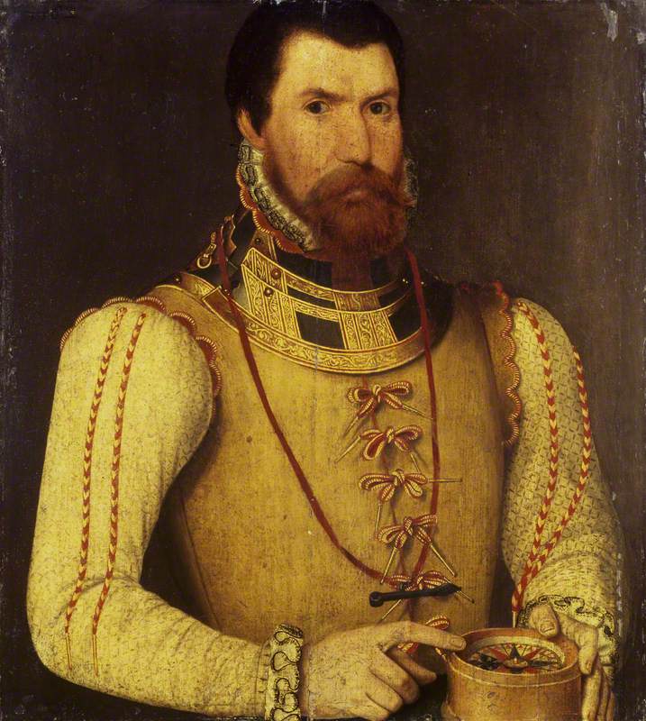 Renaissance-era portrait of a man in a splendid yellow-cream doublet, wearing a cross on a chain and sporting a thick goatee.