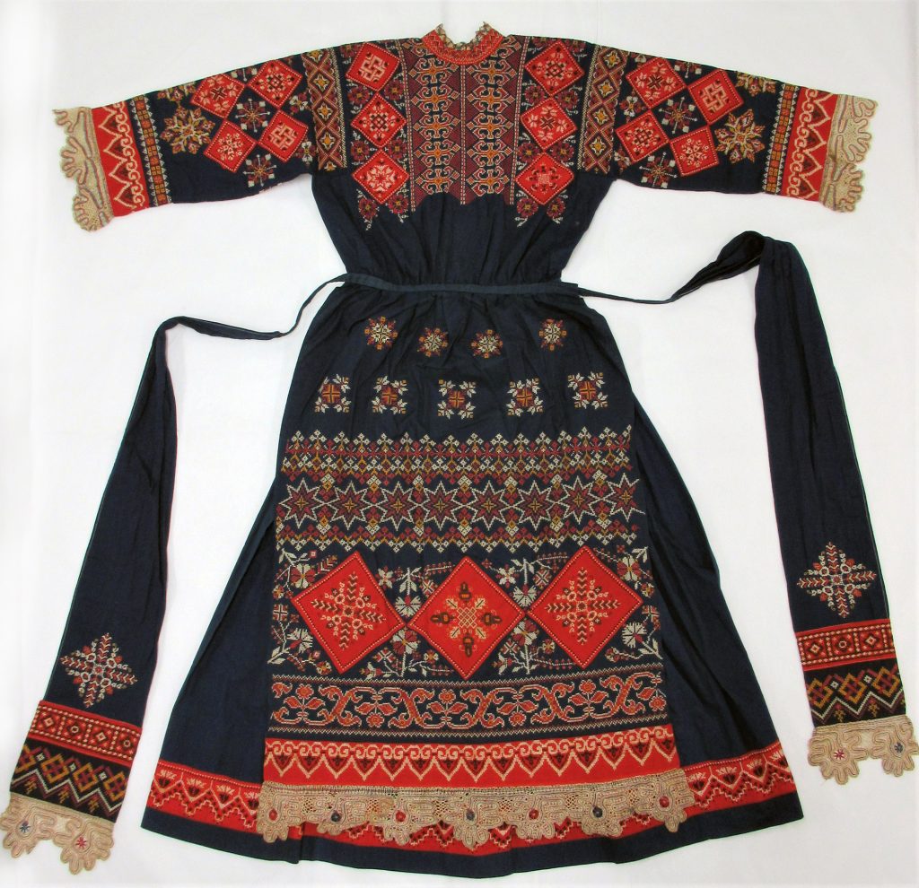 Woman’s Dress and Apron in Dark blue cotton, embroidered with cotton threads in cross stitch.