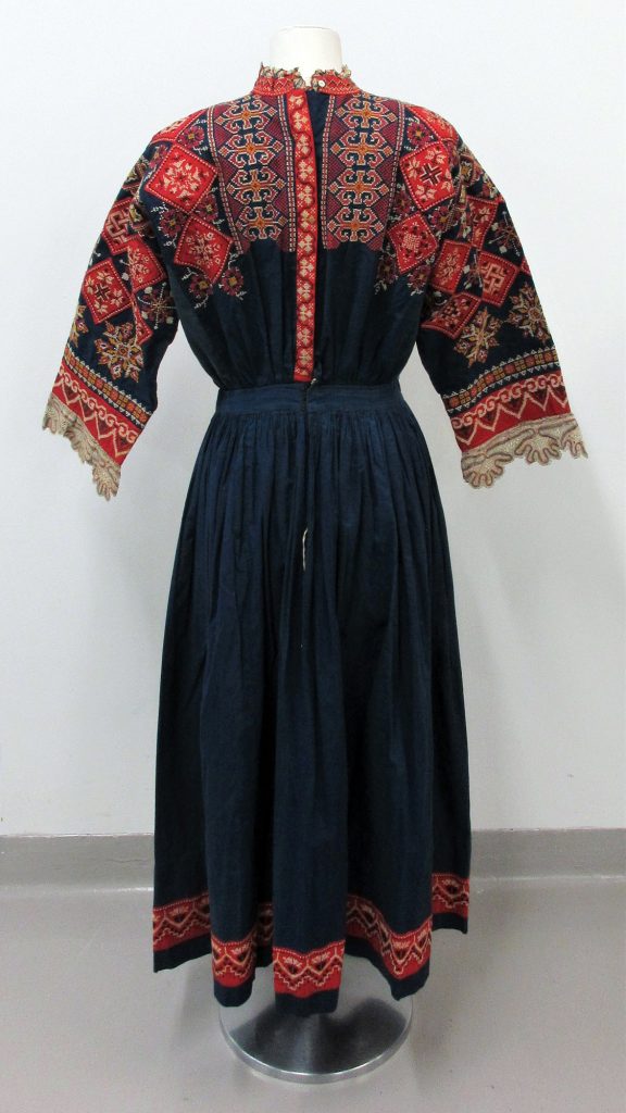 Woman’s Dress and Apron in Dark blue cotton, embroidered with cotton threads in cross stitch.