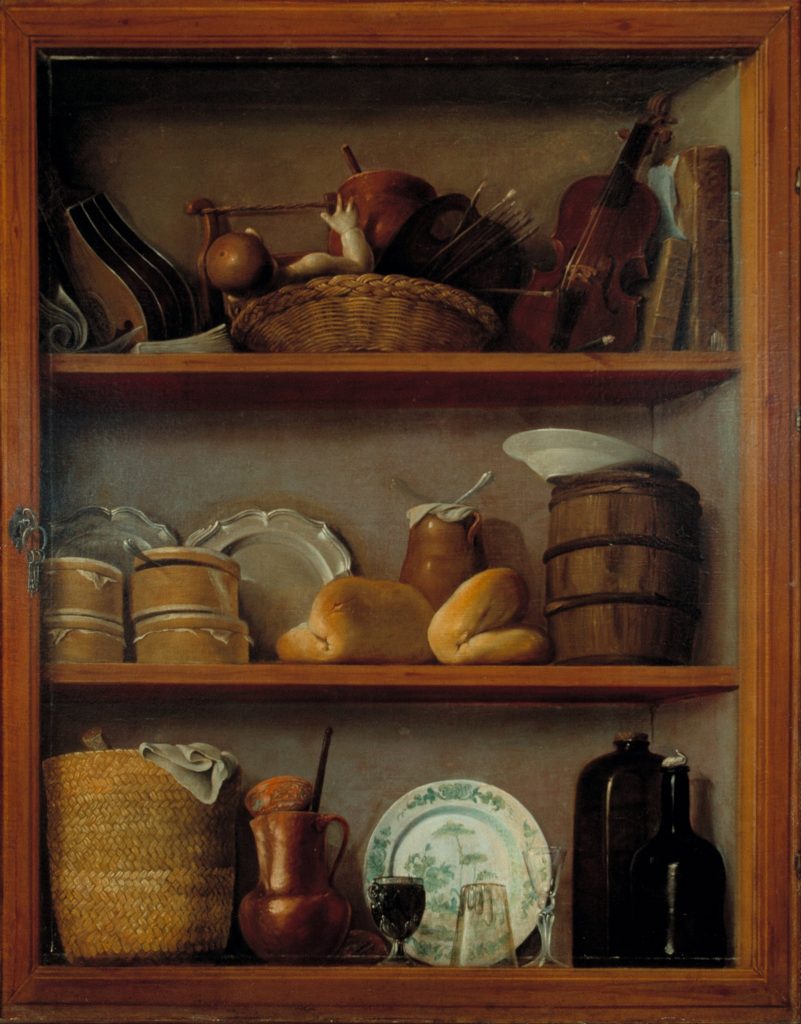 Still-life painting of a cupboard with three sections, each lined with objects including ceramic plates, a tiny violin, small barrels, wicker containers, and a coconut cup at bottom centre. Dominant colours are yellow, beige, and light brown.